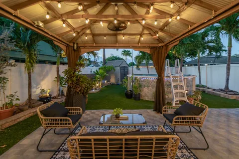 a view of an outdoor sitting area with furniture