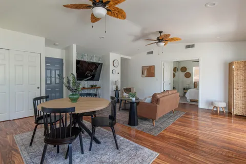 a view of a livingroom with furniture and a table