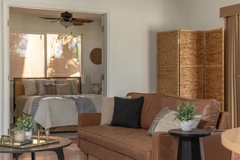a living room with furniture and a window
