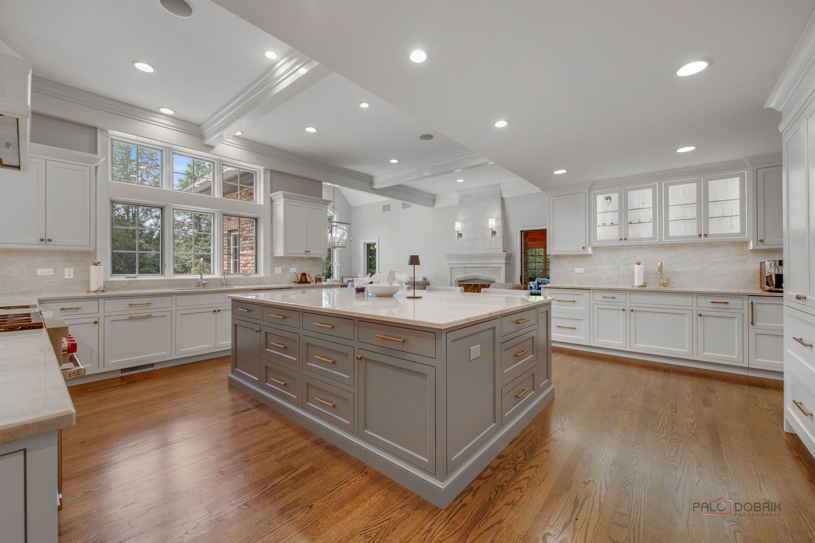 1090 Evergreen Drive Lake Forest, IL 60045 - Photo 12 of 66 a large kitchen with stainless steel appliances granite countertop a large center island and a wooden floors