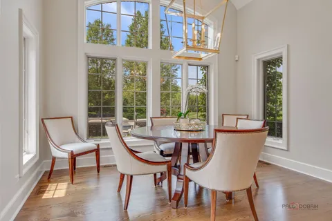 a living room with furniture and large windows