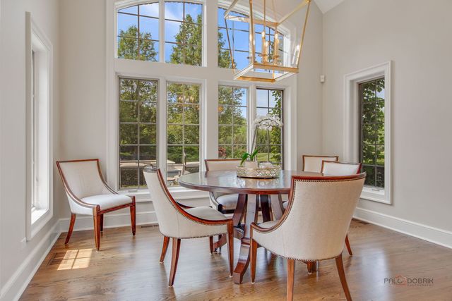 a living room with furniture and large windows