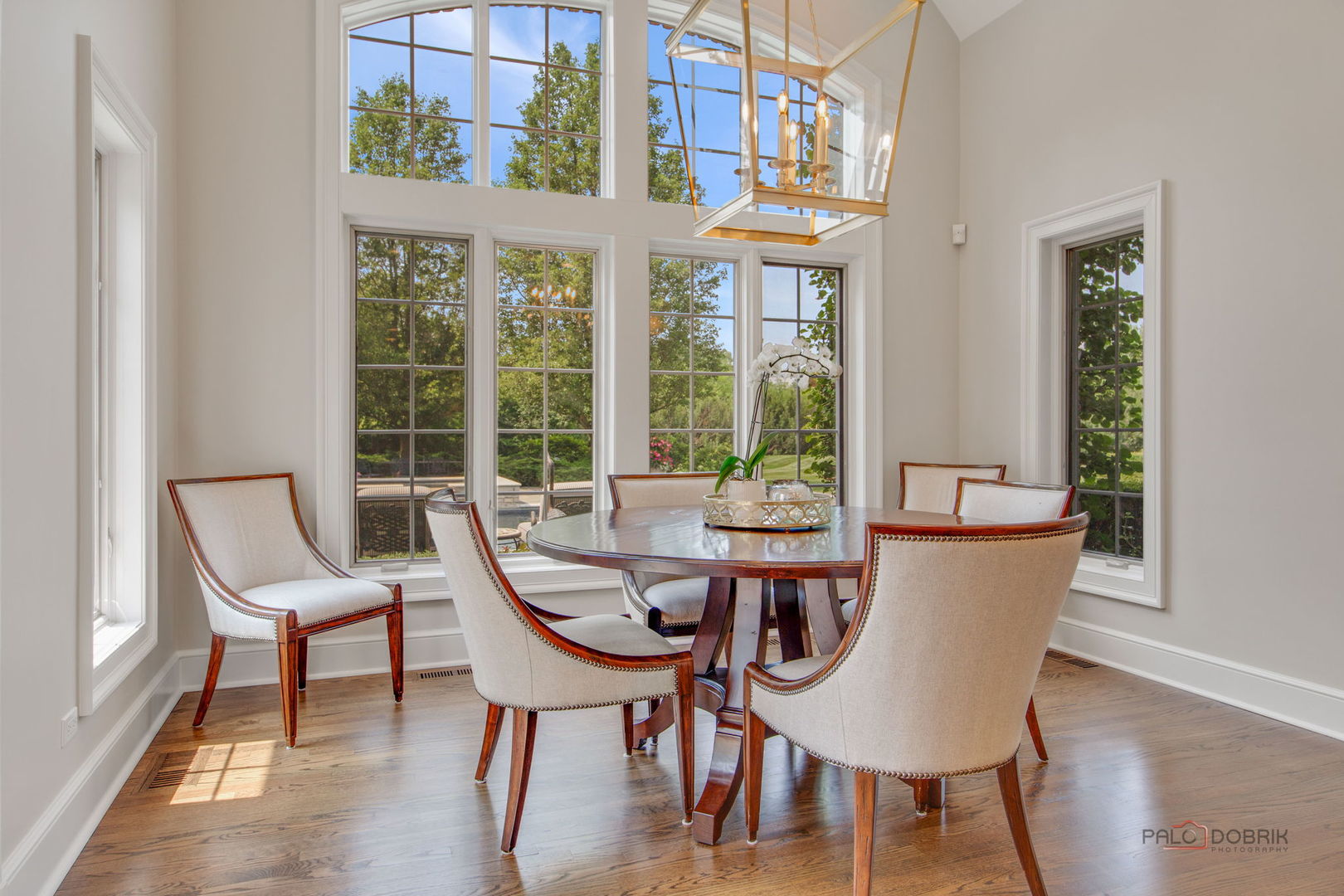 1090 Evergreen Drive Lake Forest, IL 60045 - Photo 17 of 66 a dining room with furniture a chandelier and wooden floor