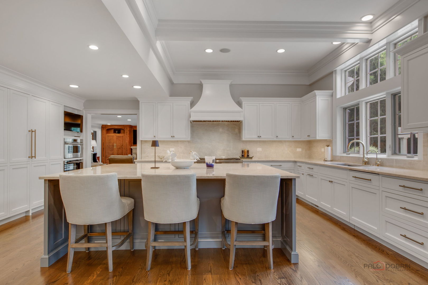 1090 Evergreen Drive Lake Forest, IL 60045 - Photo 18 of 66 a kitchen with a dining table chairs sink and cabinets