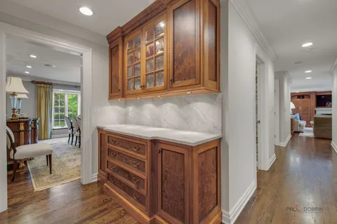 a bathroom with a granite countertop sink a mirror and shower curtain