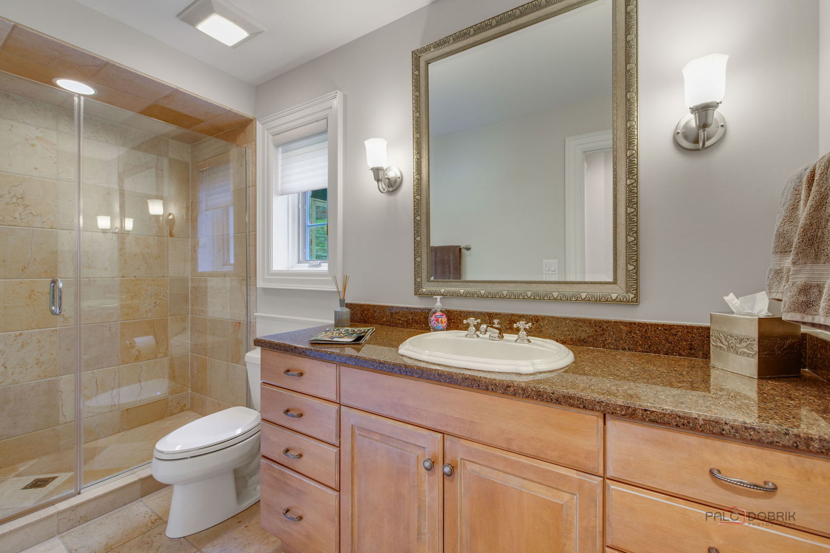 1090 Evergreen Drive Lake Forest, IL 60045 - Photo 28 of 66 a bathroom with a granite countertop sink toilet a large mirror a shower and a mirror