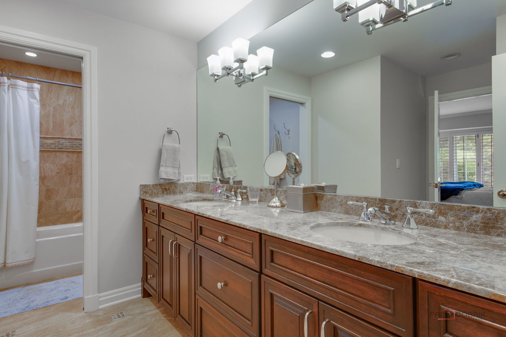 1090 Evergreen Drive Lake Forest, IL 60045 - Photo 40 of 66 a bathroom with double vanity sinks a vanity and a large mirror