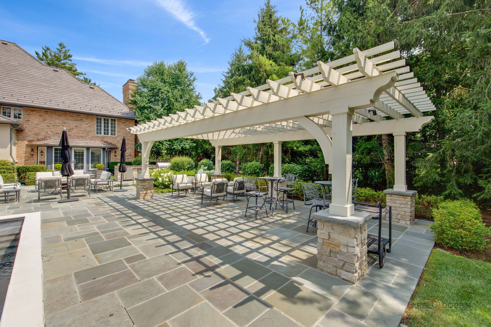 1090 Evergreen Drive Lake Forest, IL 60045 - Photo 51 of 66 a view of a patio with table and chairs and potted plants