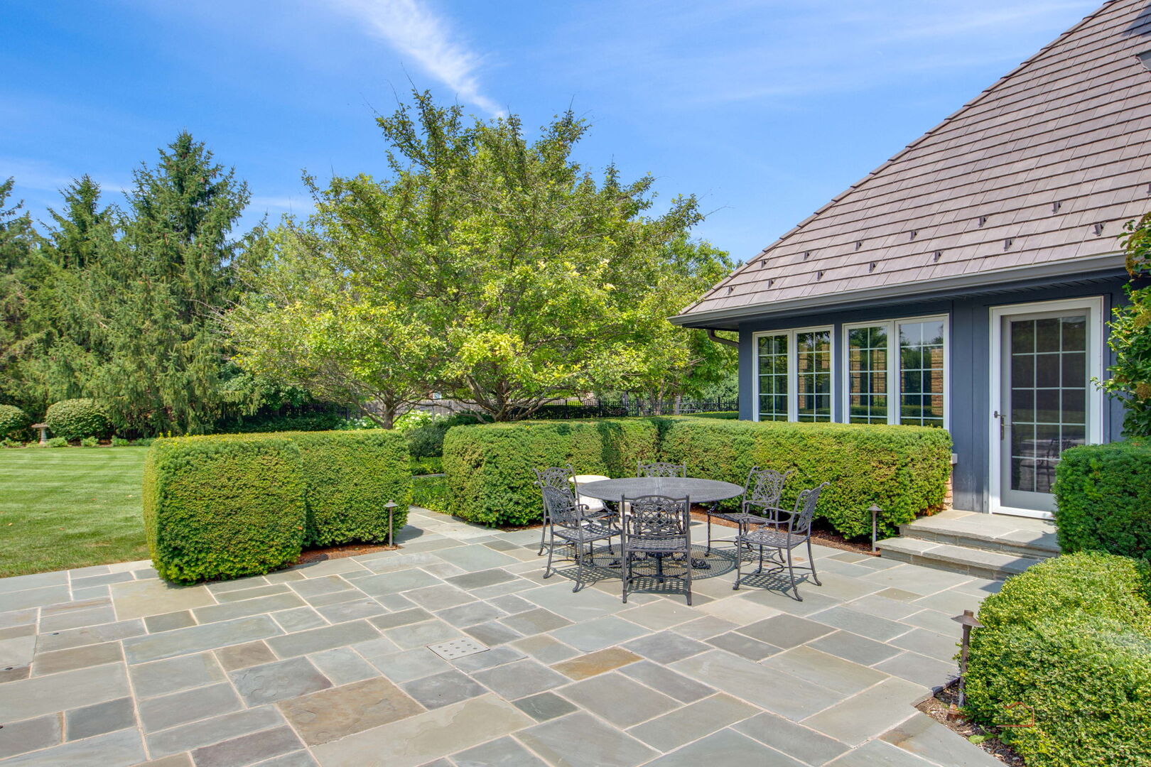 1090 Evergreen Drive Lake Forest, IL 60045 - Photo 55 of 66 a view of a house with backyard sitting area and garden