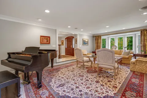 a kitchen with a dining table chairs refrigerator and cabinets