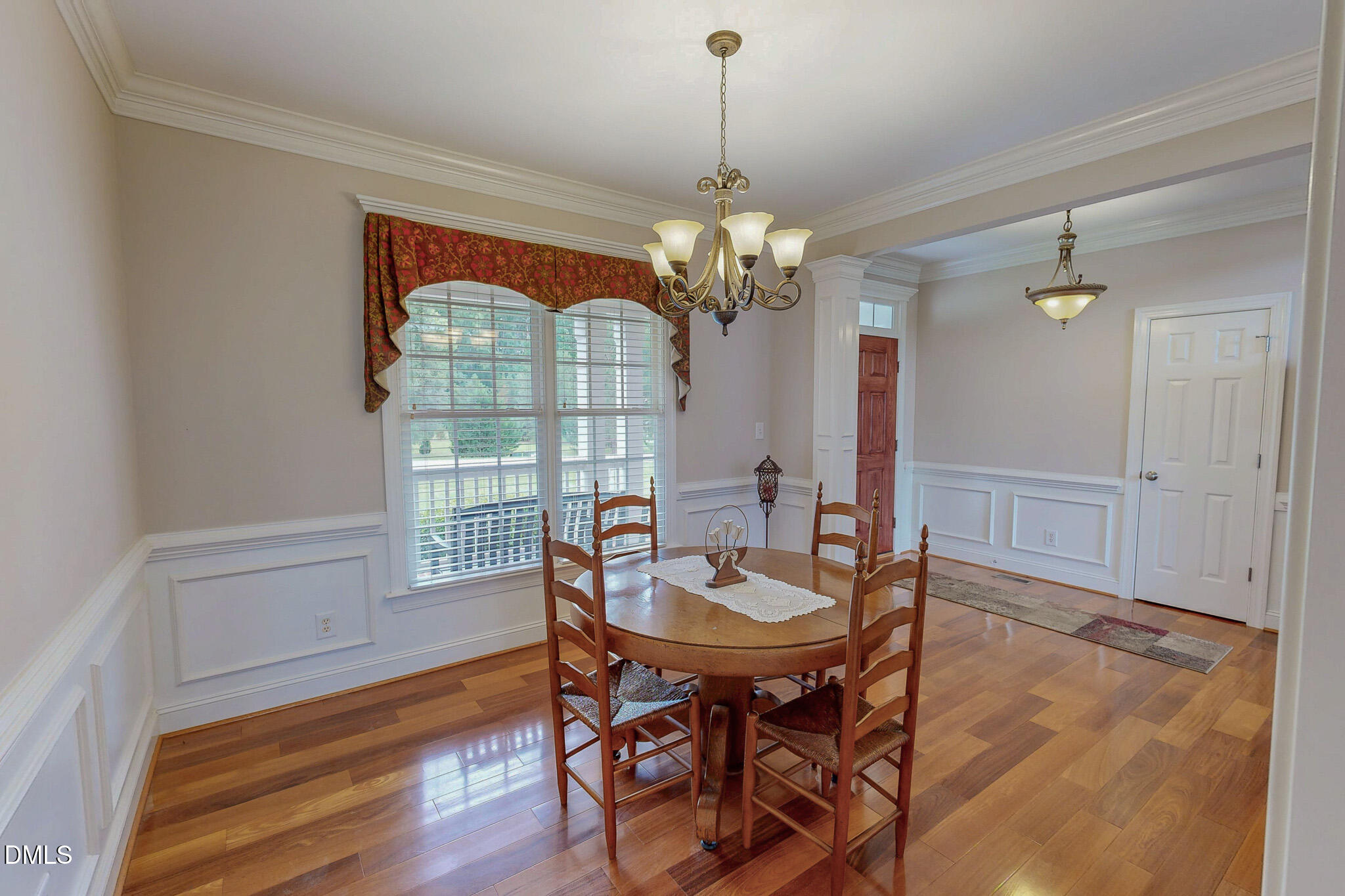 115 Duncan Plantation Road Timberlake, NC 27583 - Photo 32 of 48 a view of a dining room with furniture wooden floor and chandelier