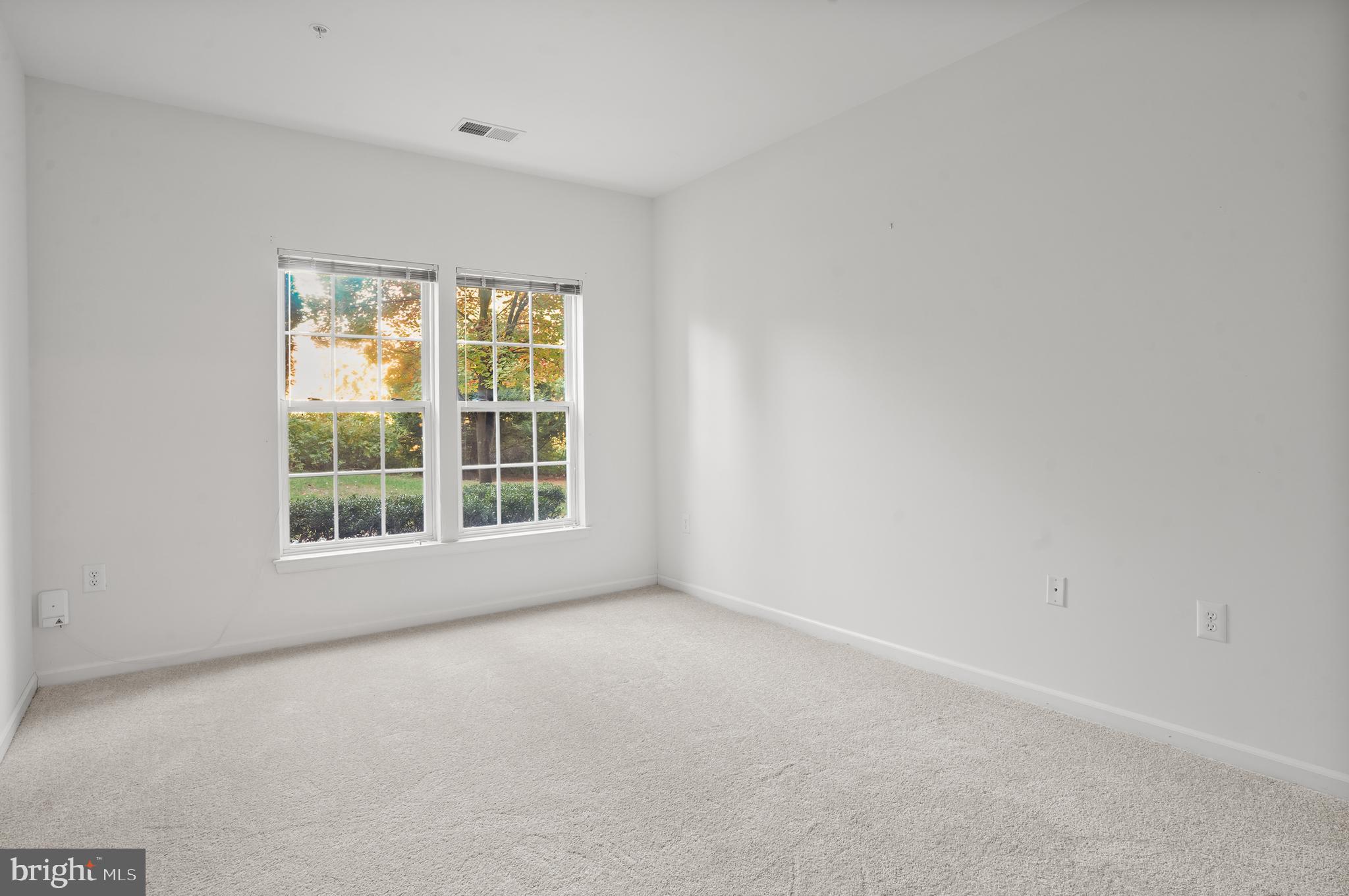 1014 Samantha Lane, Unit 102 Odenton, MD 21113 - Photo 11 of 32 an empty room with a window