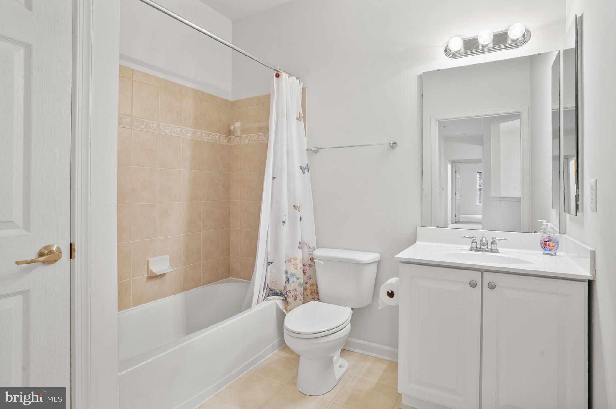 1014 Samantha Lane, Unit 102 Odenton, MD 21113 - Photo 13 of 32 a bathroom with a sink a toilet and shower