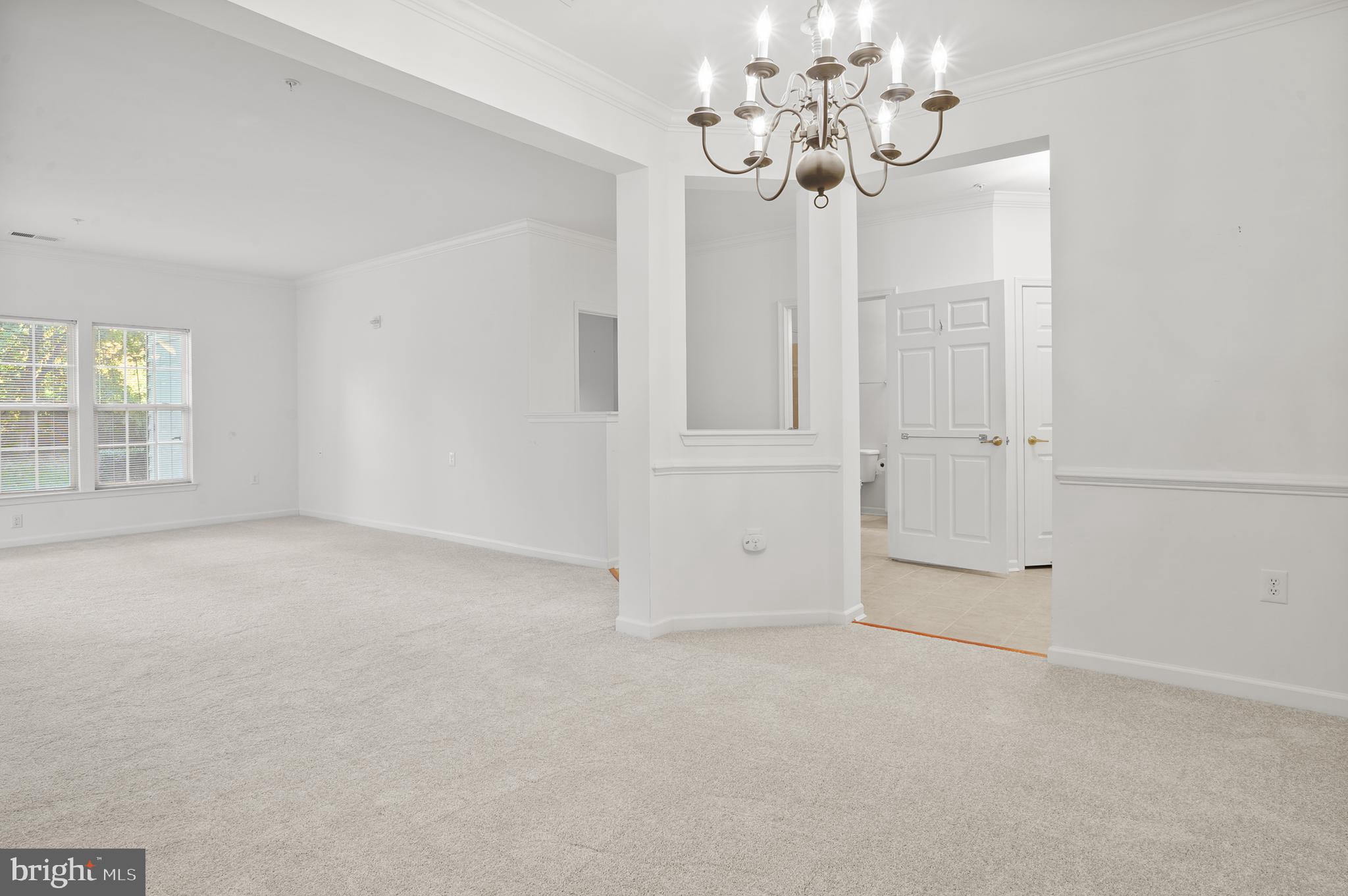 1014 Samantha Lane, Unit 102 Odenton, MD 21113 - Photo 14 of 32 a view of an empty room with a window