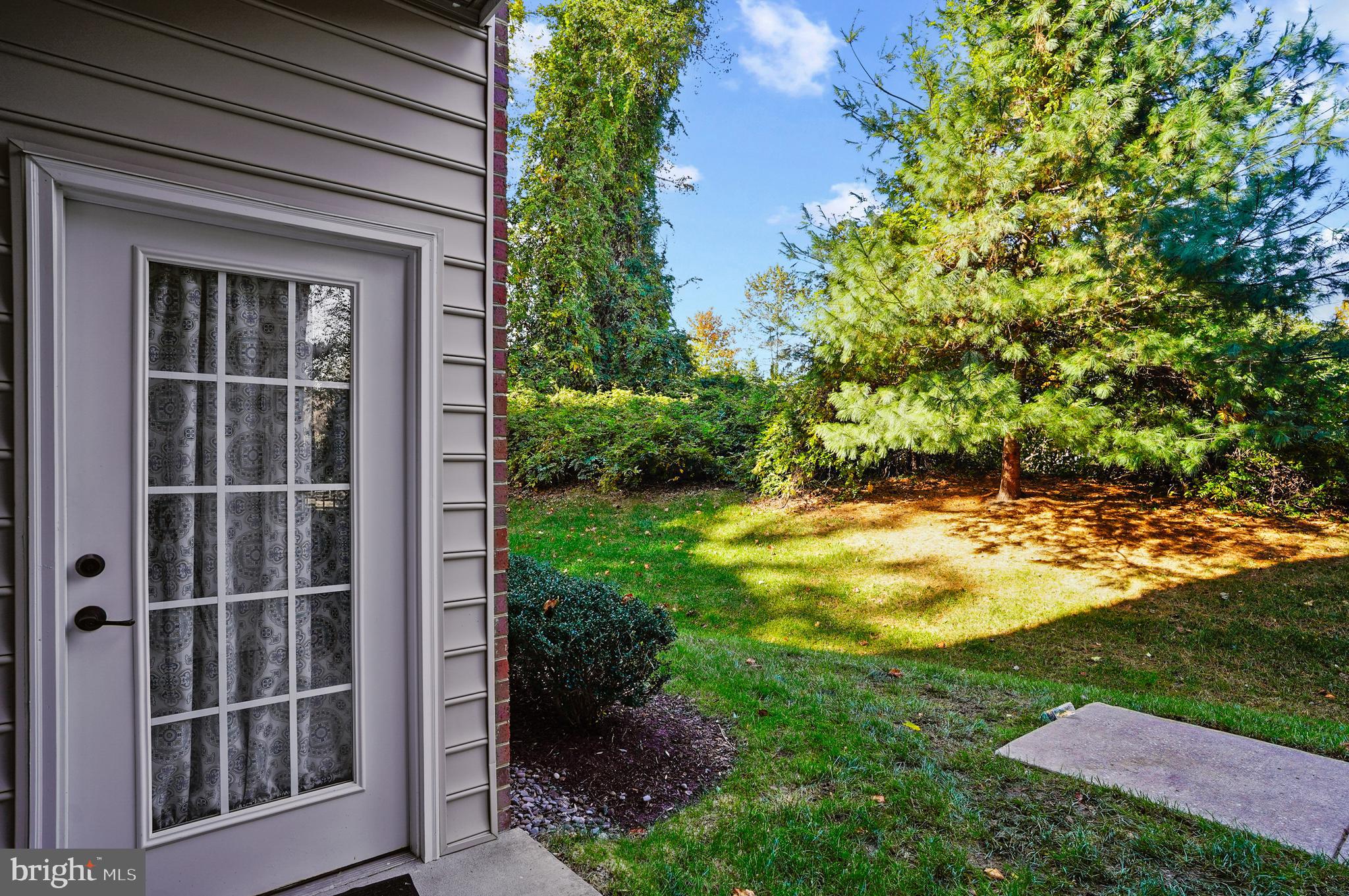 1014 Samantha Lane, Unit 102 Odenton, MD 21113 - Photo 20 of 32 a view of a house with a yard