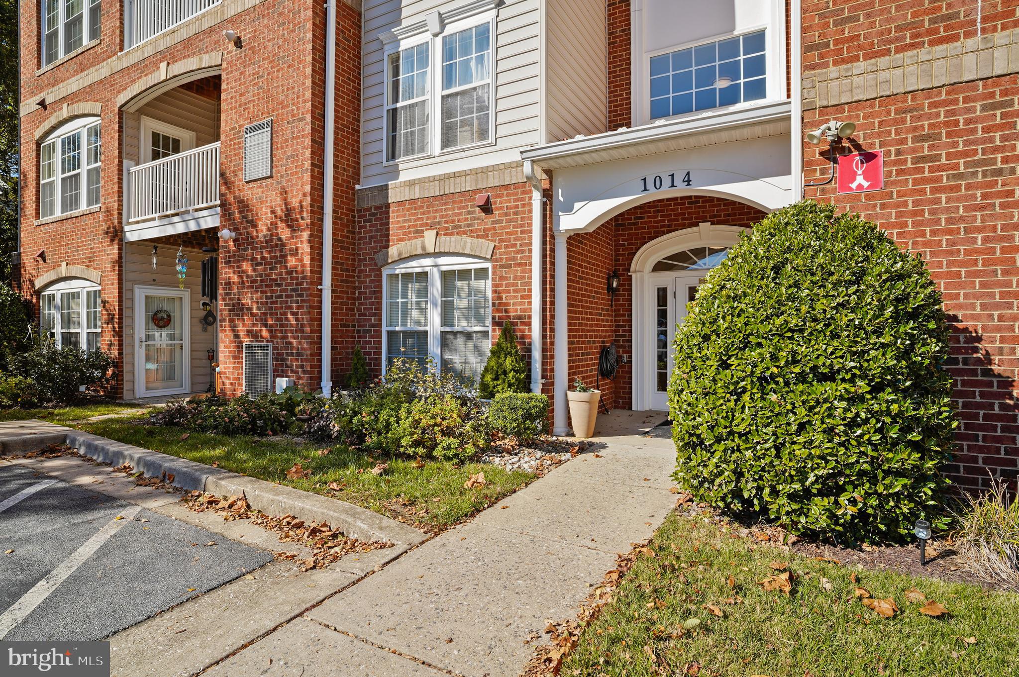 1014 Samantha Lane, Unit 102 Odenton, MD 21113 - Photo 2 of 32 a front view of a multi story residential apartment building