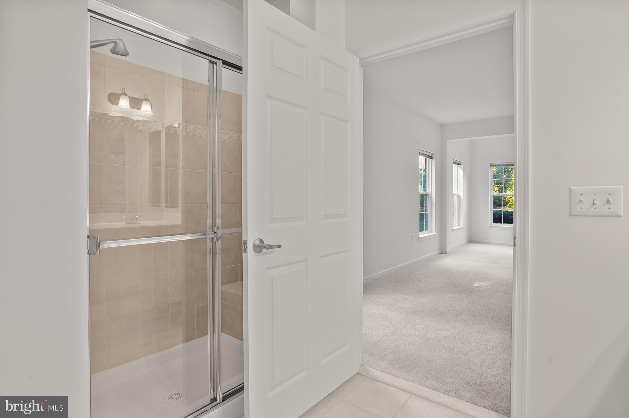 1014 Samantha Lane, Unit 102 Odenton, MD 21113 - Photo 21 of 32 a view of a bathroom from a hallway