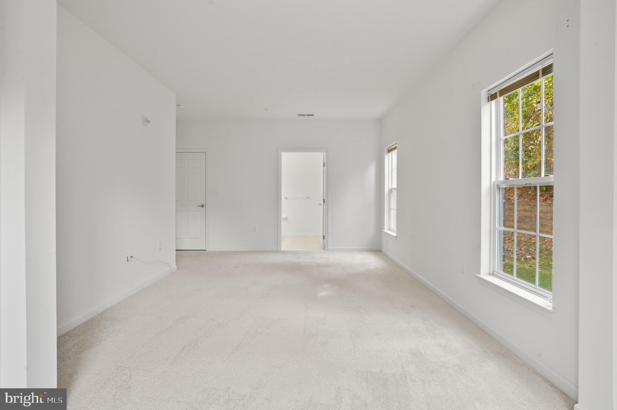 1014 Samantha Lane, Unit 102 Odenton, MD 21113 - Photo 24 of 32 a view of an empty room with a window