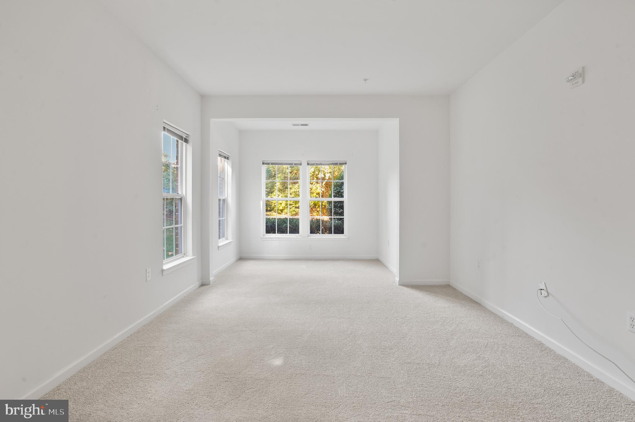 1014 Samantha Lane, Unit 102 Odenton, MD 21113 - Photo 25 of 32 a view of an empty room with a window