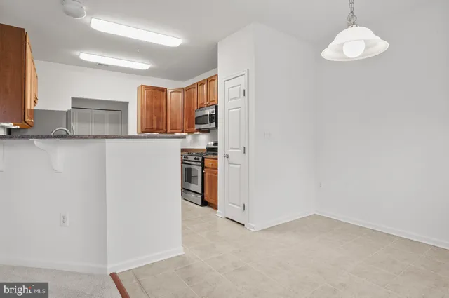 a view of kitchen with wooden floor
