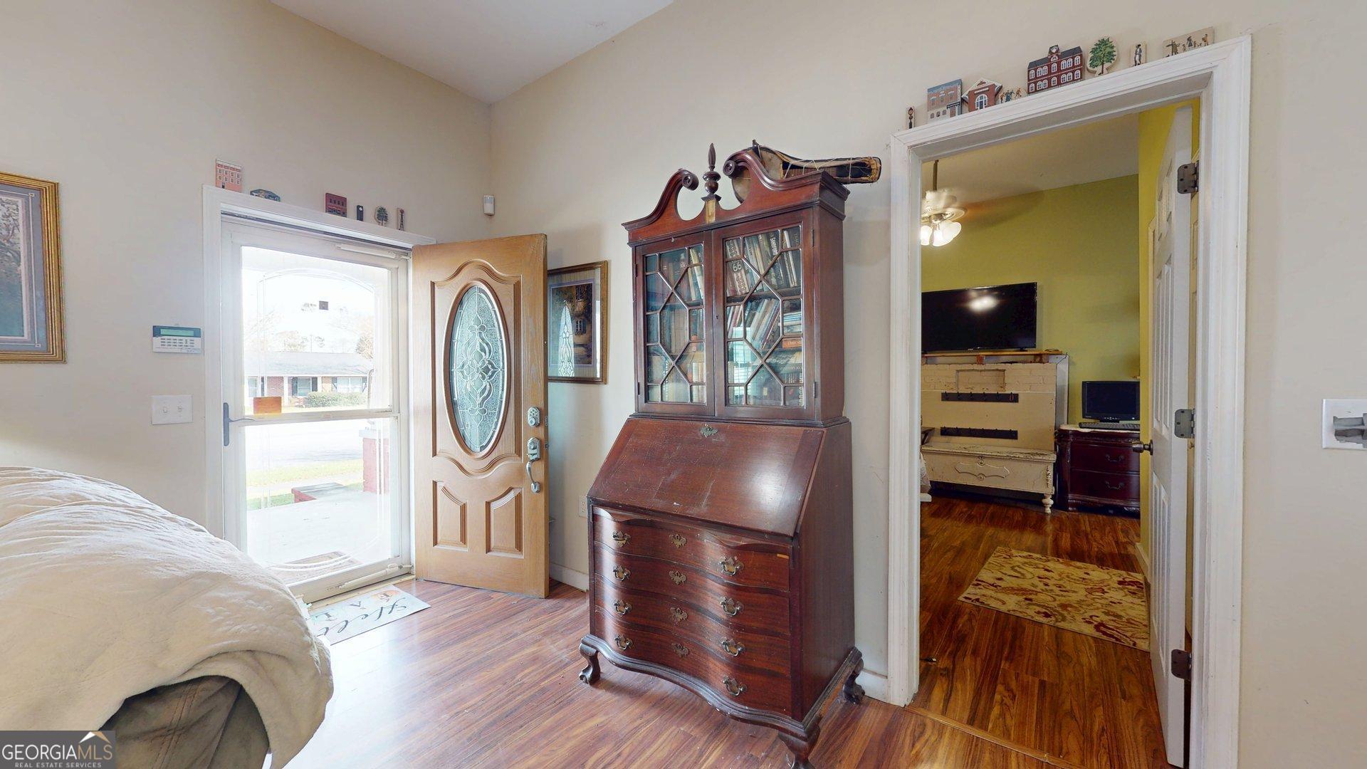 297 North Rountree Street Metter, GA 30439 - Photo 11 of 34 a living room with furniture and a window