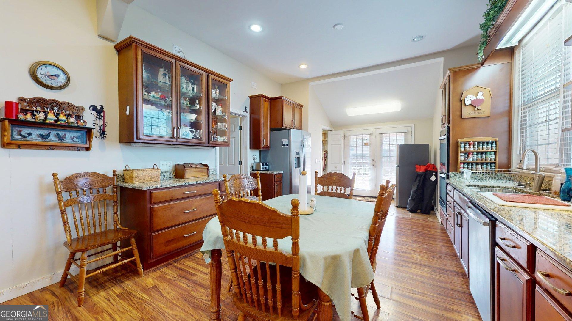 297 North Rountree Street Metter, GA 30439 - Photo 15 of 34 a dining room with furniture and wooden floor