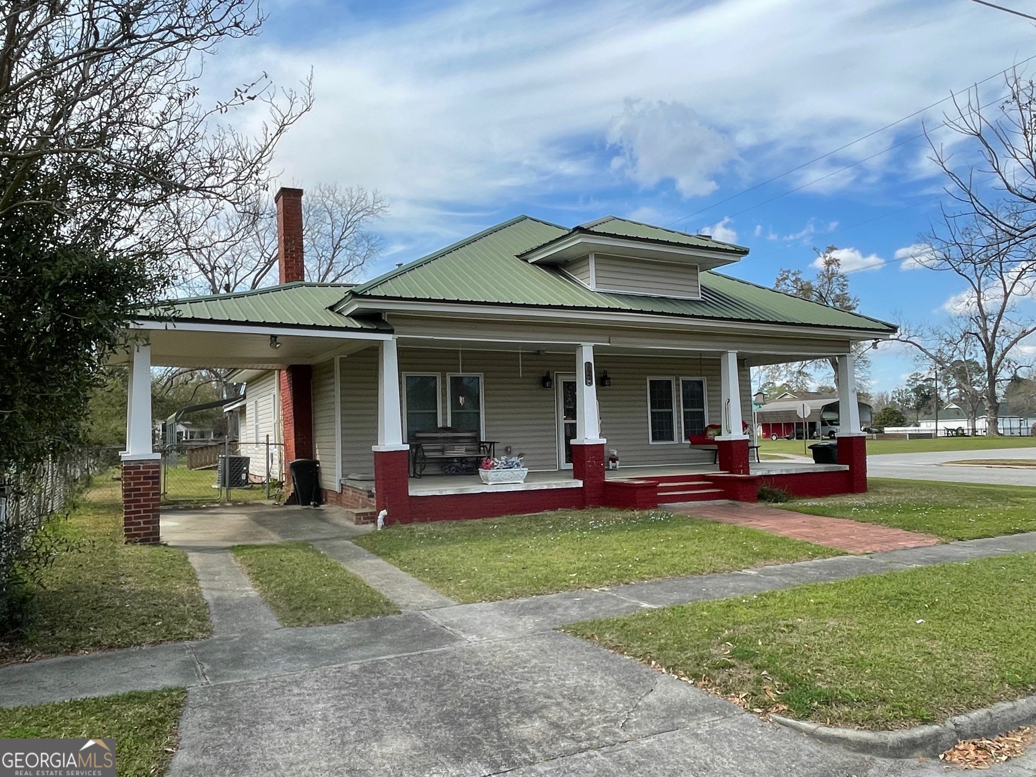 297 North Rountree Street Metter, GA 30439 - Photo 2 of 34 a view of a house with sitting area and garden