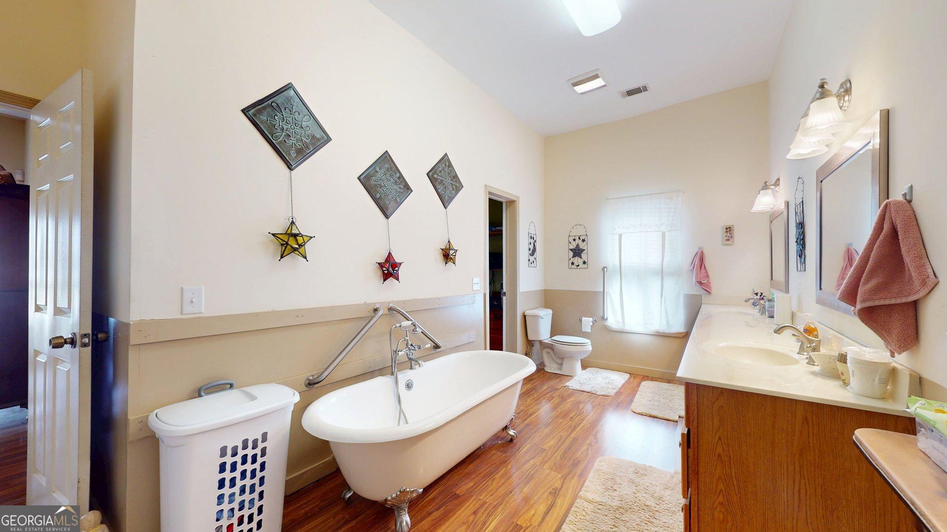 297 North Rountree Street Metter, GA 30439 - Photo 22 of 34 a living room with furniture and a wooden floor