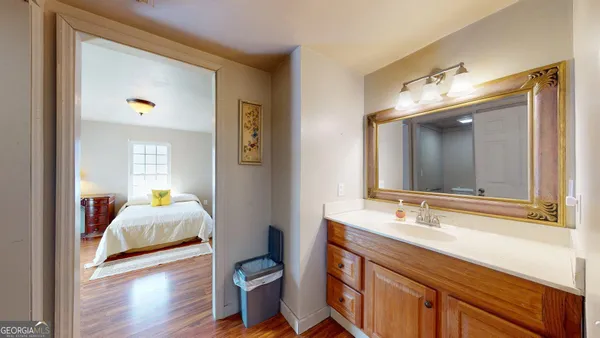 a en suite bathroom with a sink and a mirror