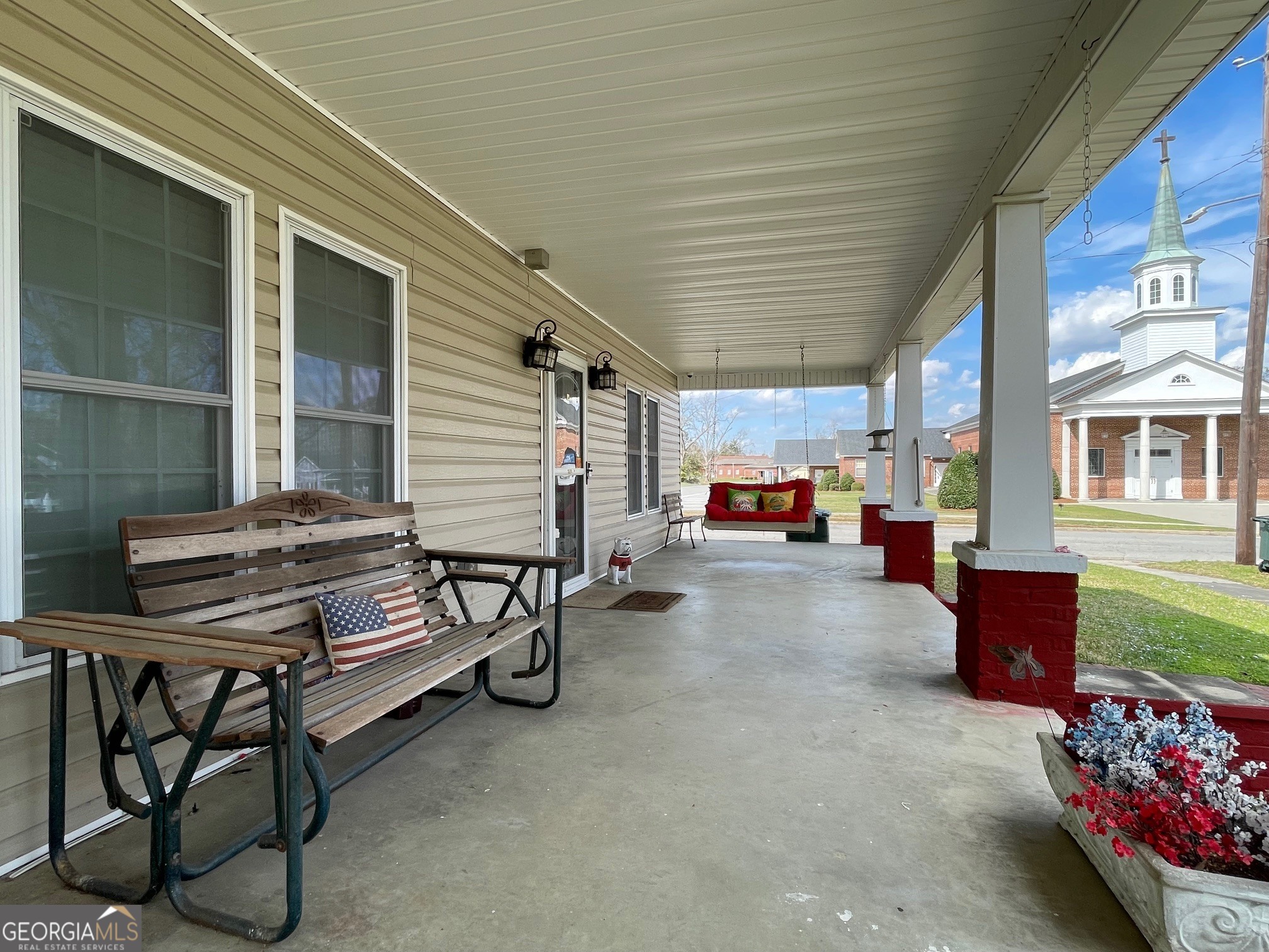 297 North Rountree Street Metter, GA 30439 - Photo 4 of 34 a view of a patio with table and chairs and potted plants