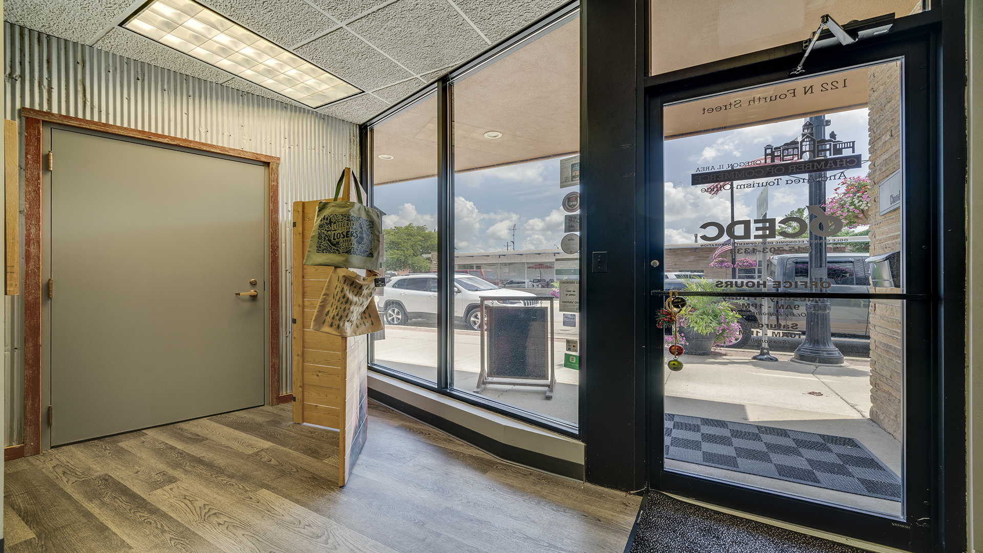 122 North 4th Street Oregon, IL 61061 - Photo 8 of 32 a view of an entryway with wooden floor and a floor to ceiling window