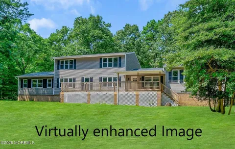 a view of house with a big yard