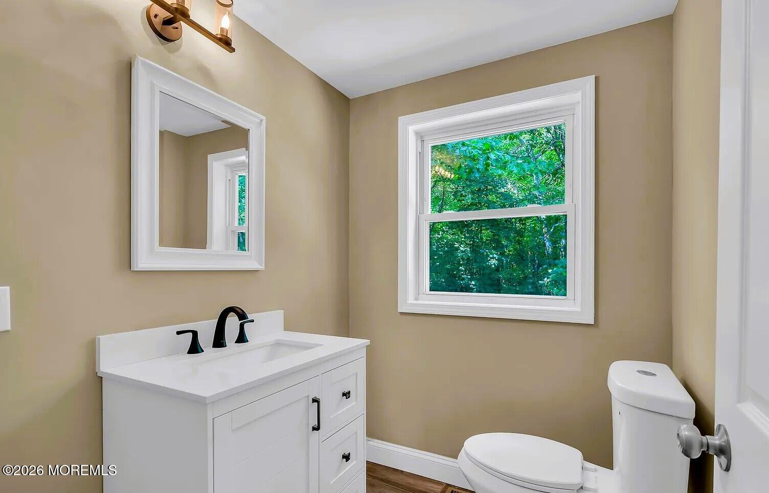 510 Pinehurst Road Cream Ridge, NJ 08514 - Photo 15 of 57 a white toilet sitting next to a bathroom sink