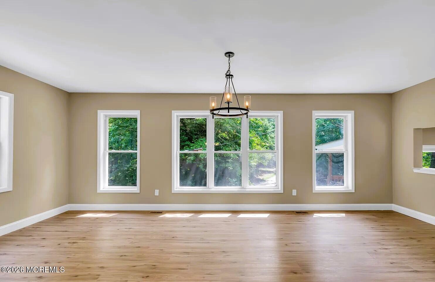 510 Pinehurst Road Cream Ridge, NJ 08514 - Photo 16 of 57 a view of an empty room with wooden floor and a window