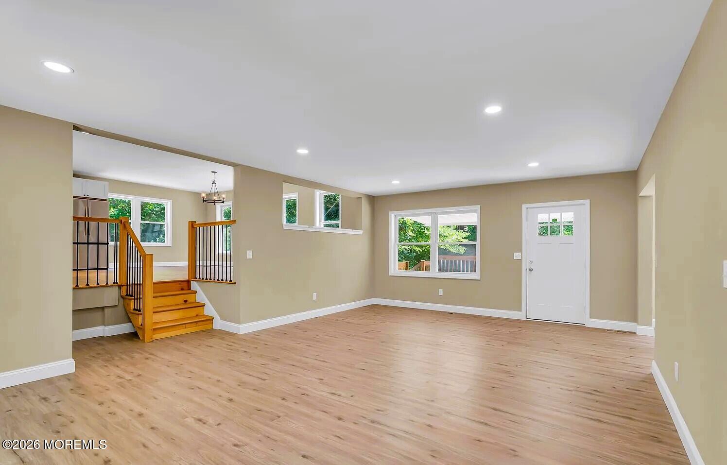 510 Pinehurst Road Cream Ridge, NJ 08514 - Photo 19 of 57 a view of an empty room with wooden floor and windows