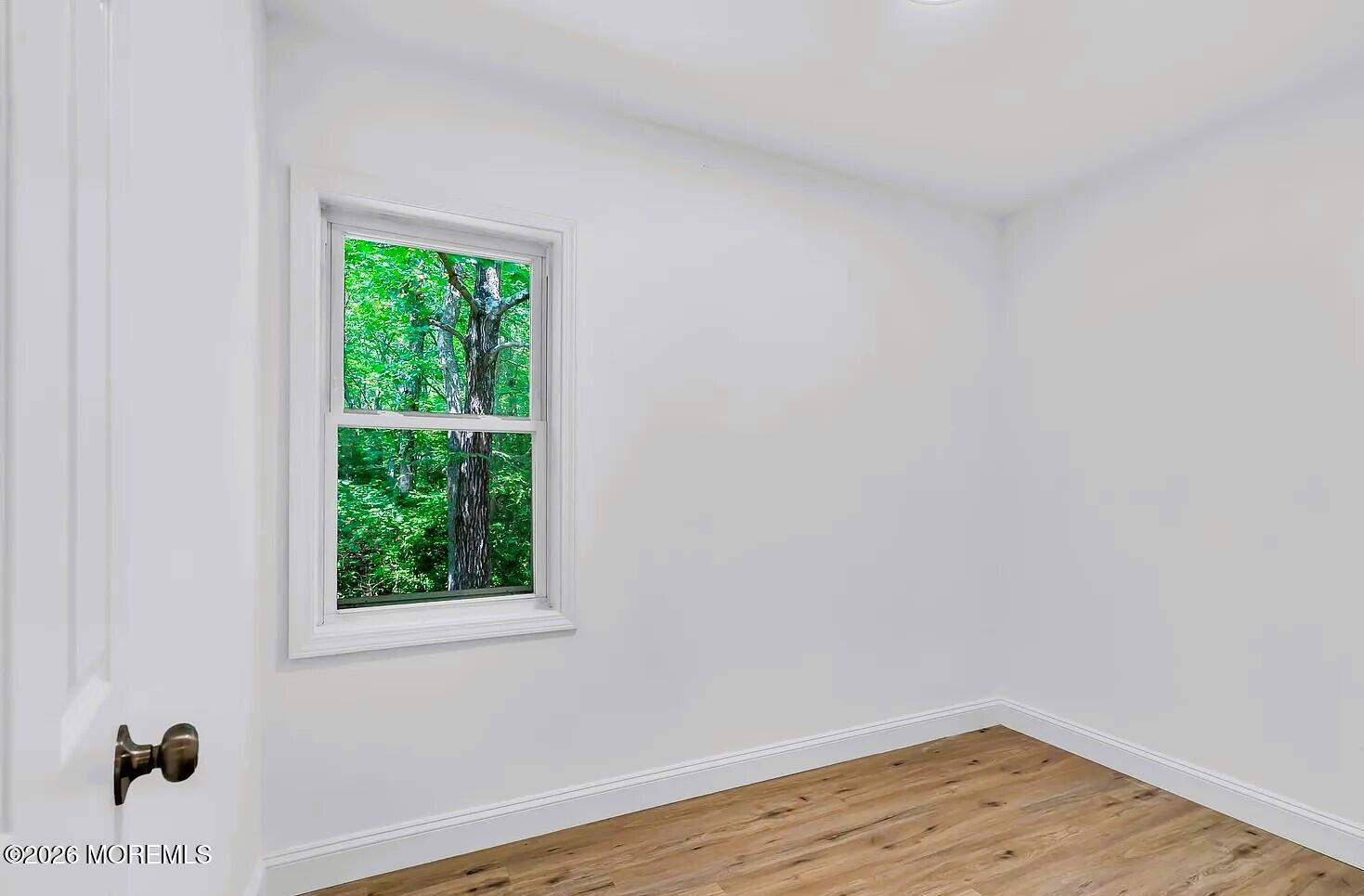 510 Pinehurst Road Cream Ridge, NJ 08514 - Photo 22 of 57 a view of a room that has wooden floor and a window