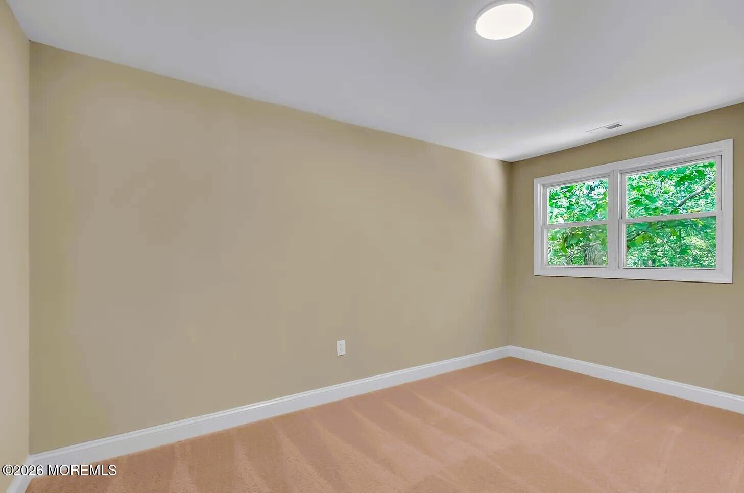 510 Pinehurst Road Cream Ridge, NJ 08514 - Photo 23 of 57 a view of an empty room with a window