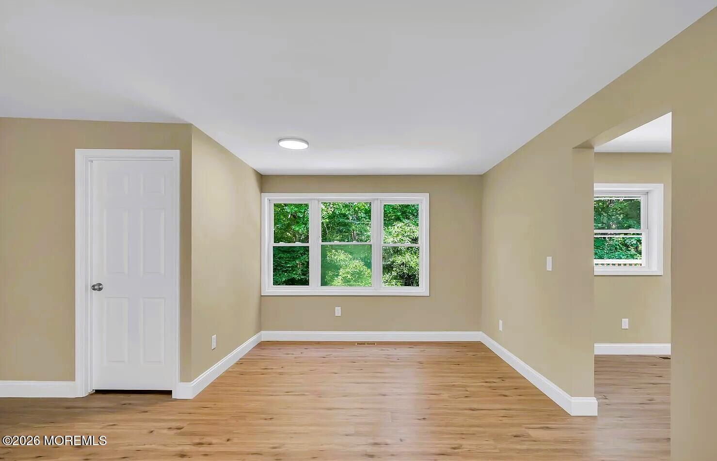 510 Pinehurst Road Cream Ridge, NJ 08514 - Photo 29 of 57 a view of an empty room with wooden floor and a window