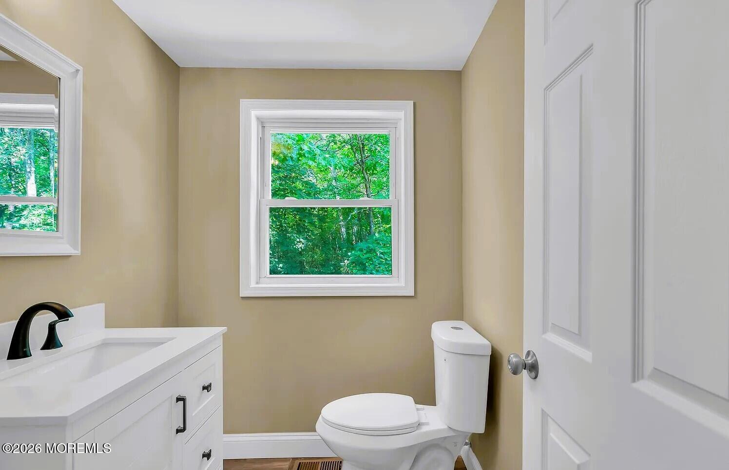 510 Pinehurst Road Cream Ridge, NJ 08514 - Photo 30 of 57 a bathroom with a sink a toilet and a window