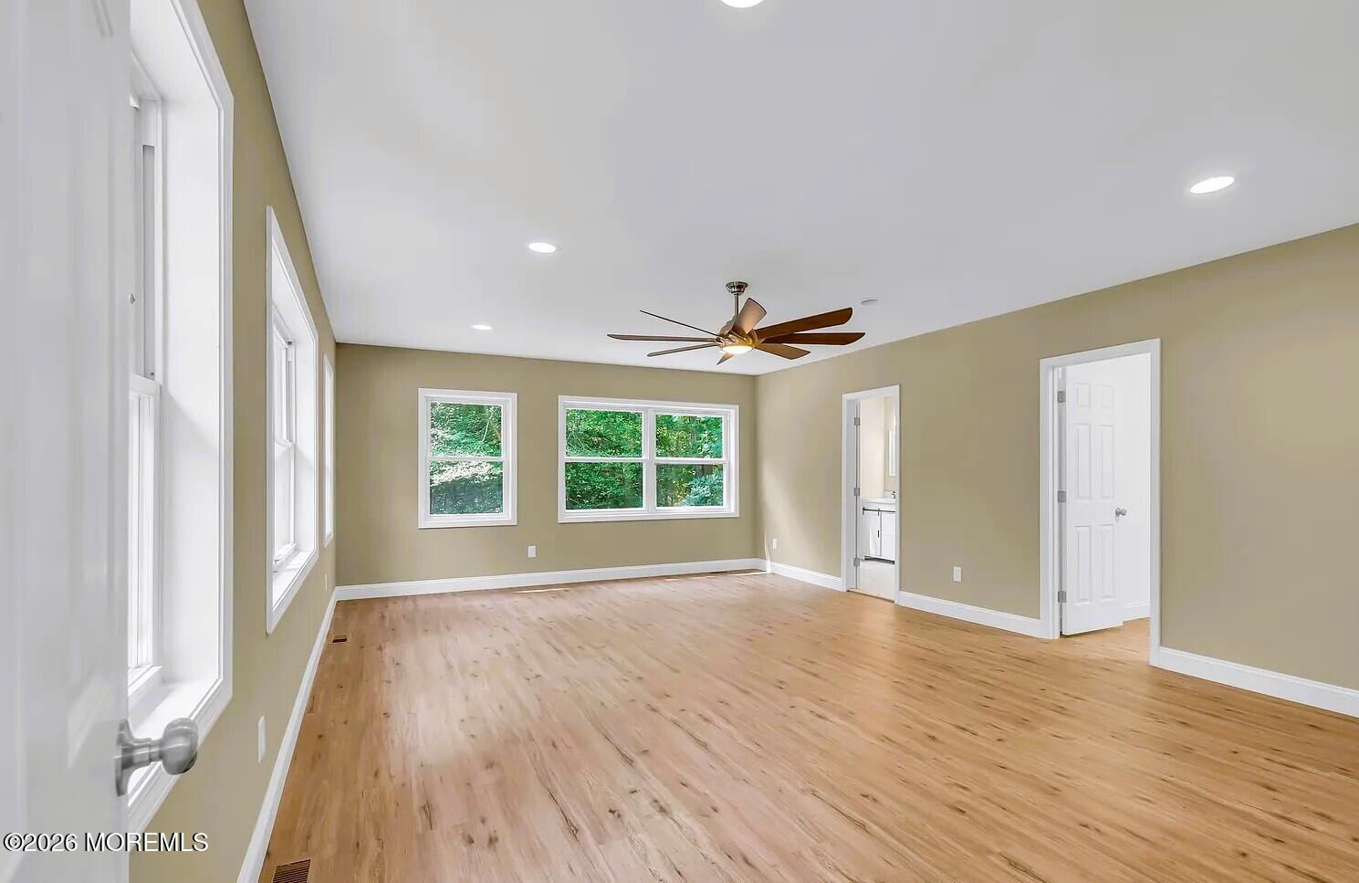 510 Pinehurst Road Cream Ridge, NJ 08514 - Photo 36 of 57 a view of an empty room with wooden floor and a window