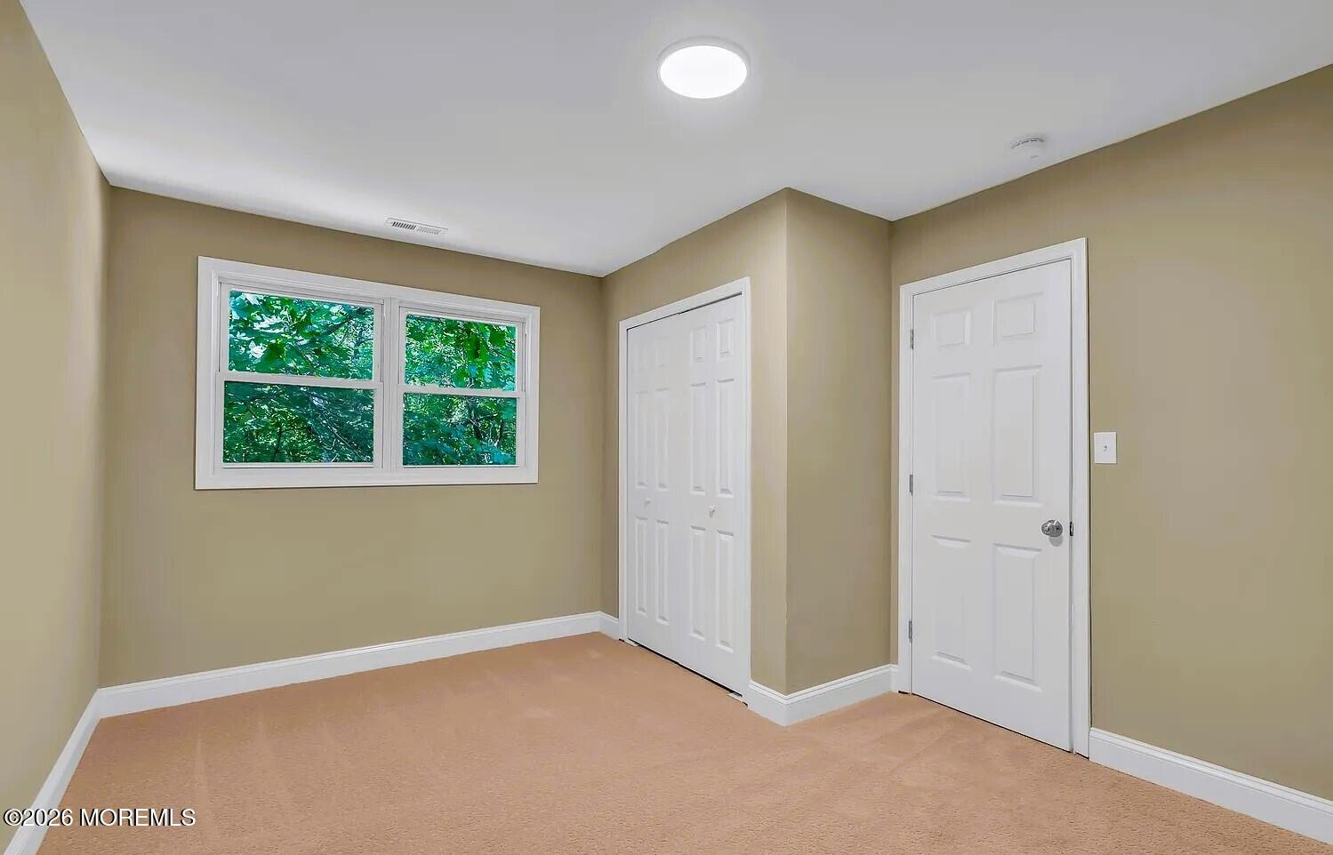 510 Pinehurst Road Cream Ridge, NJ 08514 - Photo 45 of 57 an empty room with a window
