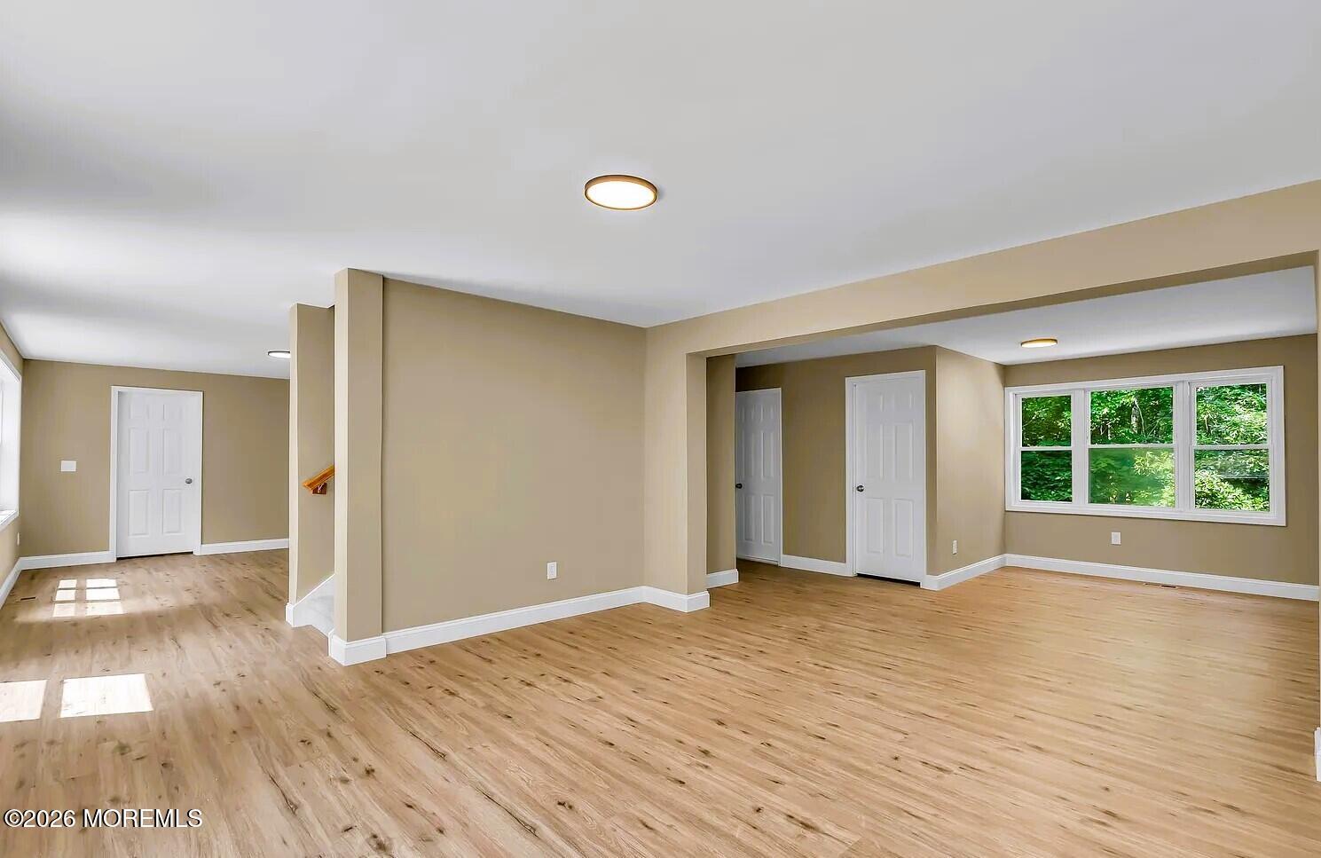 510 Pinehurst Road Cream Ridge, NJ 08514 - Photo 52 of 57 a view of an empty room with wooden floor and windows
