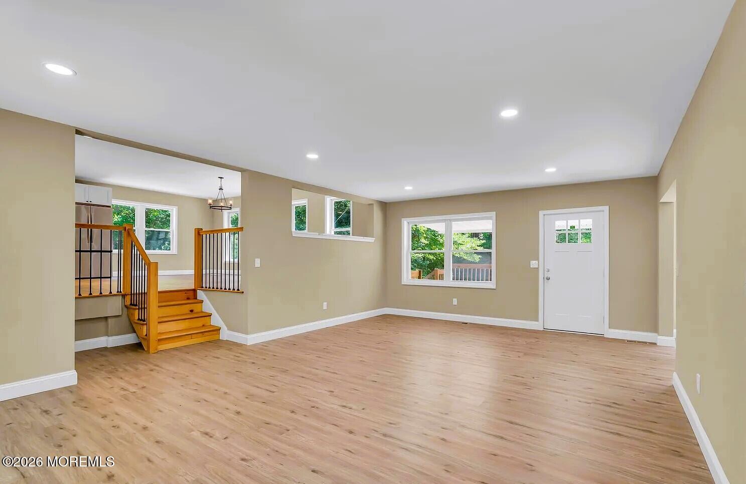 510 Pinehurst Road Cream Ridge, NJ 08514 - Photo 6 of 57 a view of an empty room with wooden floor and windows
