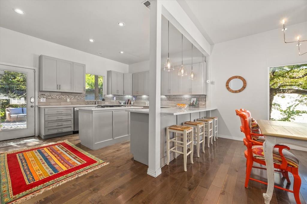 6121 Sharon Road Fort Worth, TX 76116 - Photo 15 of 37 a kitchen with stainless steel appliances a dining table chairs and view living room