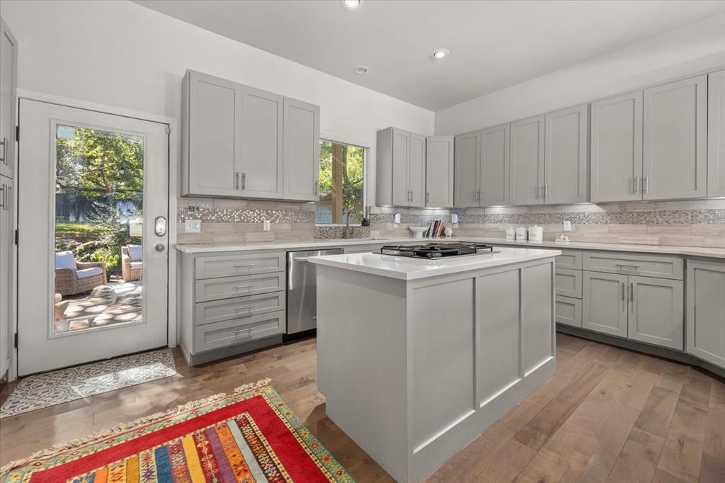 6121 Sharon Road Fort Worth, TX 76116 - Photo 19 of 37 a kitchen with a sink stove and cabinets