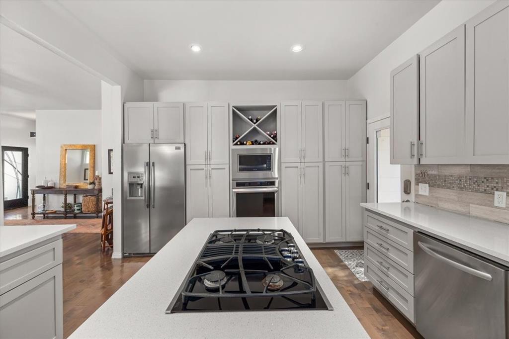 6121 Sharon Road Fort Worth, TX 76116 - Photo 20 of 37 a kitchen with a stove a refrigerator and a sink