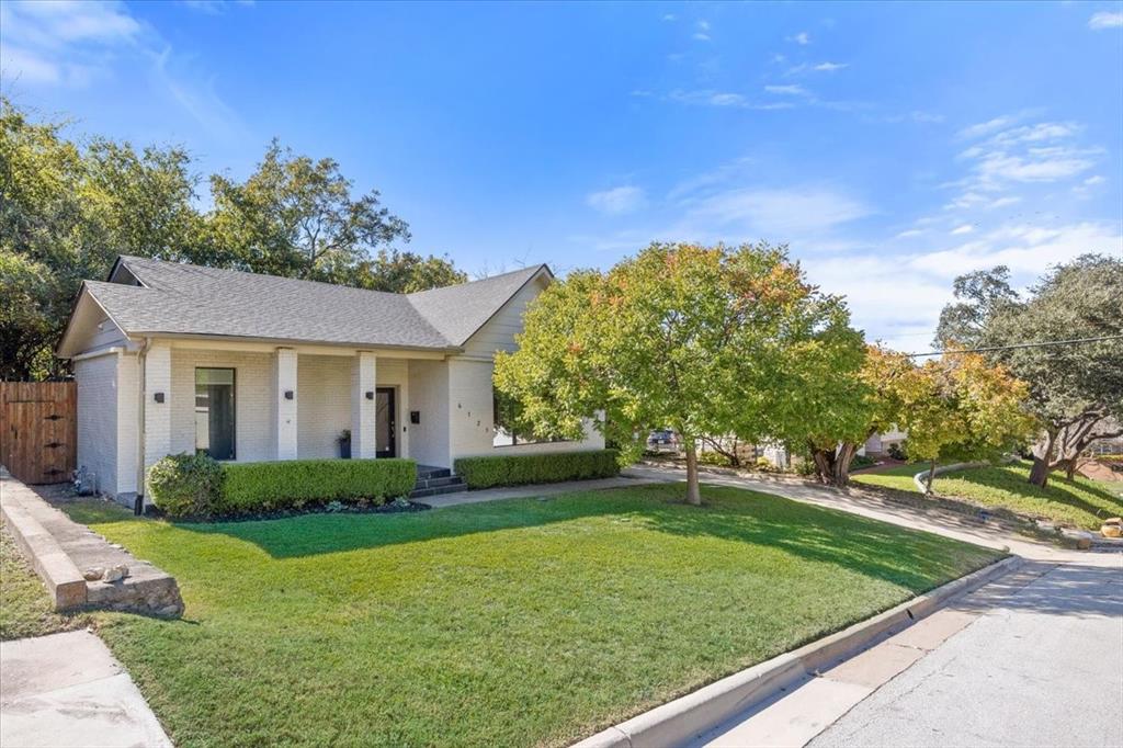 6121 Sharon Road Fort Worth, TX 76116 - Photo 2 of 37 a front view of a house with a yard