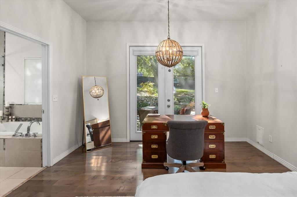 6121 Sharon Road Fort Worth, TX 76116 - Photo 22 of 37 a view of a dining room with furniture wooden floor and chandelier