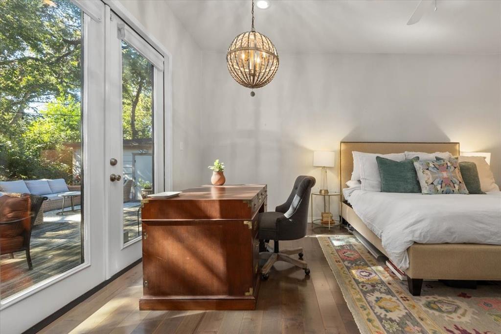 6121 Sharon Road Fort Worth, TX 76116 - Photo 23 of 37 a bed sitting in a bedroom next to a window