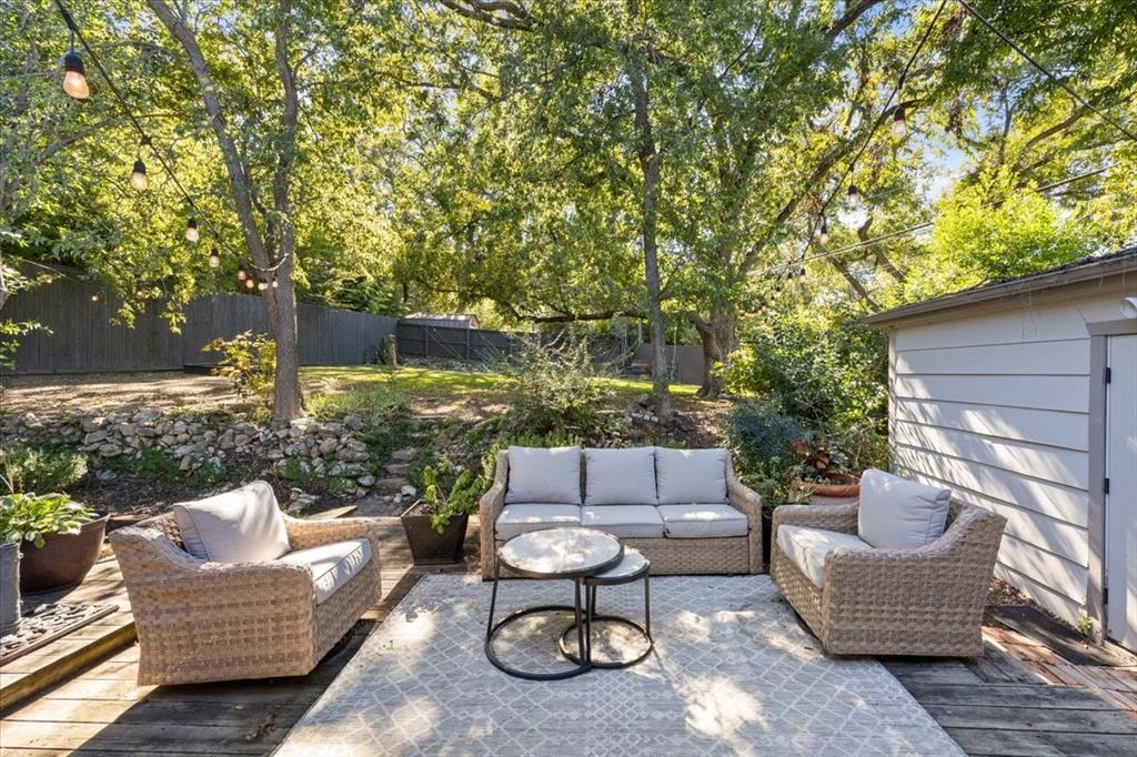 6121 Sharon Road Fort Worth, TX 76116 - Photo 31 of 37 a backyard of a house with fire pit table and chairs